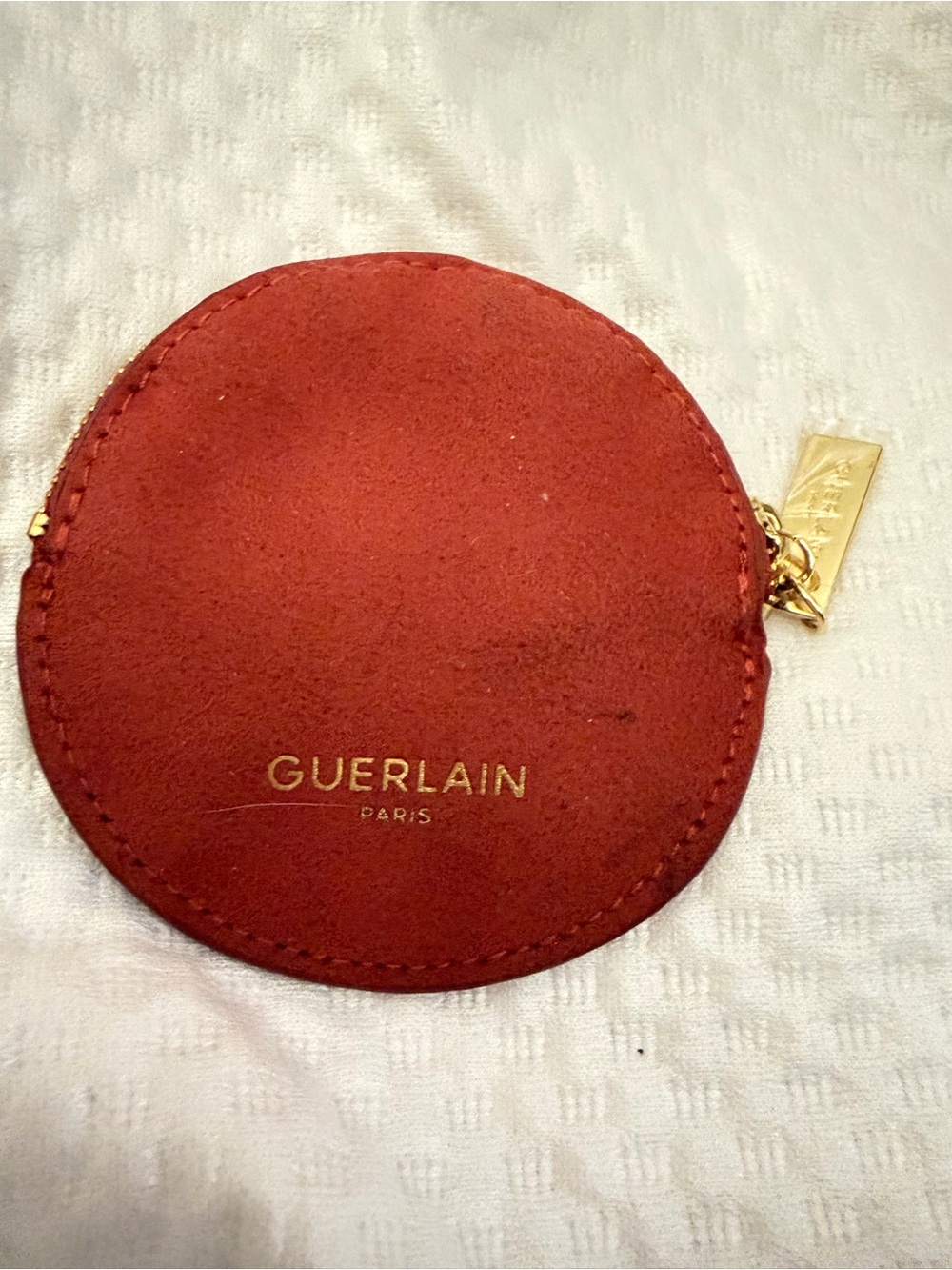 GUERLAIN Round Suede Coin Pouch in Rust Red with Gold Hardware